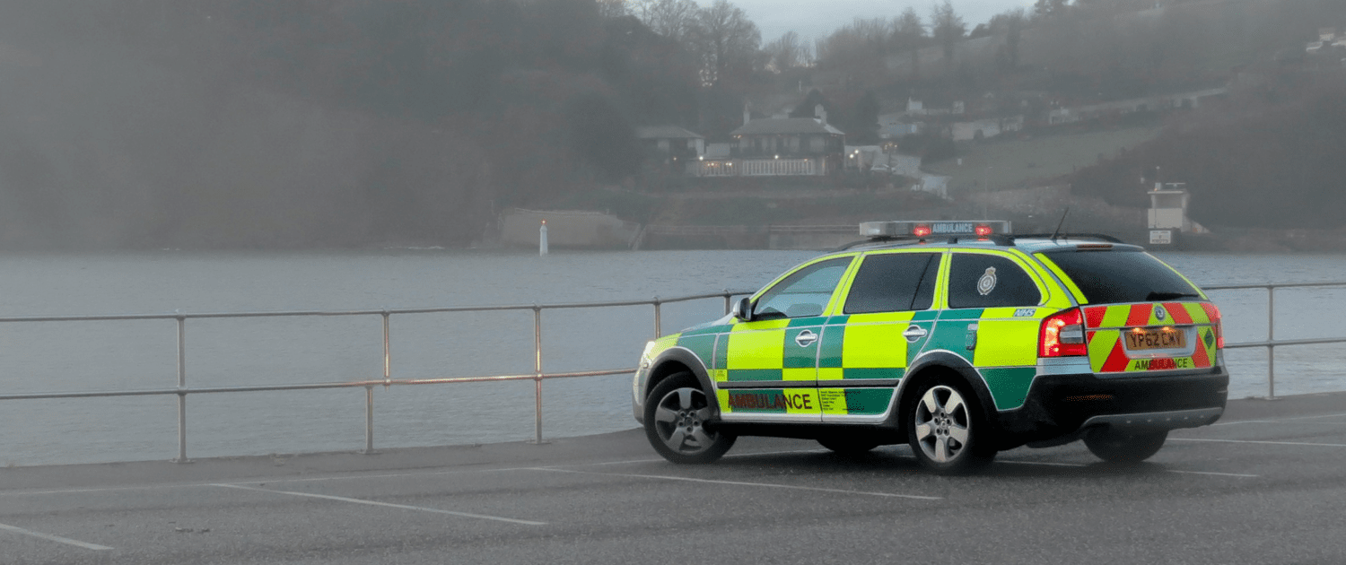 Ambulance parked by a river
